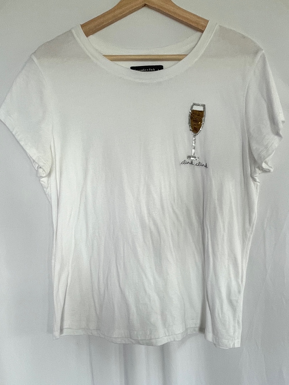 Abercrombie & Fitch White Short-Sleeve Tee with Gold Sequin Champagne Glass